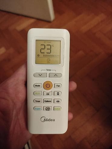 Mašine za šivenje: Daljinski za klimu Midea.Ispravan — 2