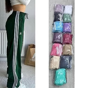 Nove ženske pantalone od mokre likre sa prugama sa strane. Sportski