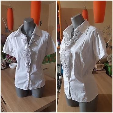 Bela ženska košulja Michel Bustos sa kratkim rukavima i volanima duž na lalafo.rs Bela ženska košulja Michel Bustos sa kratkim rukavima i volanima duž