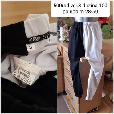 Duks pantalone u crno-beloj kombinaciji (half–half dizajn). -