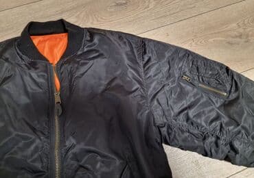 new yorker crna gora online: Crna bomber jakna (MA-1 stil) sa narandžastom postavom. - Materijal — 3