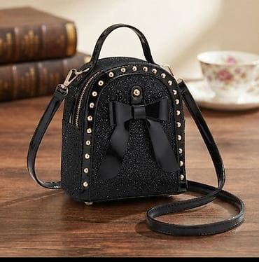 mona paracin – слике: Mini tašna preko ramena – crna, elegantna i efektna - Kompaktan model — 1