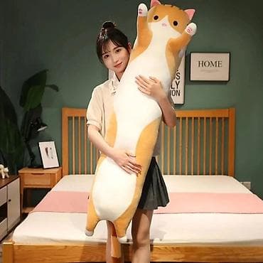 izrada jastuka za garniture: Duguljasti jastuk u obliku mačke postaje sve popularniji izbor za one — 1