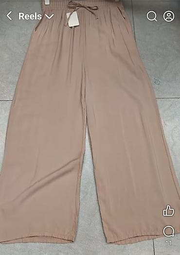 Siroke pantalone sa finim padom. Veliki elasticni pojas sa uckurom