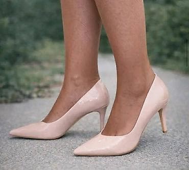 Elegantne ženske salonke sa špicastim vrhom i tankom potpeticom. -