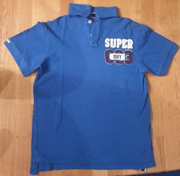 zimske jakne c a: SuperDry, super dry plava polo majica sa kragnicom. Piše XL velicina — 1