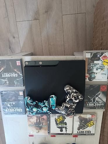 rostilj beli: PlayStation 3 Slim konzola (crna) sa 2 bežična DualShock 3 kontrolera — 2