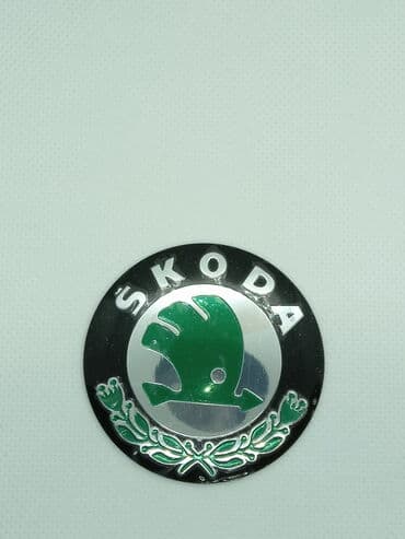 20555 r16 felni: ŠKODA - plastificirane nalepnice za felne - set od 4 komada ŠKODA - — 4