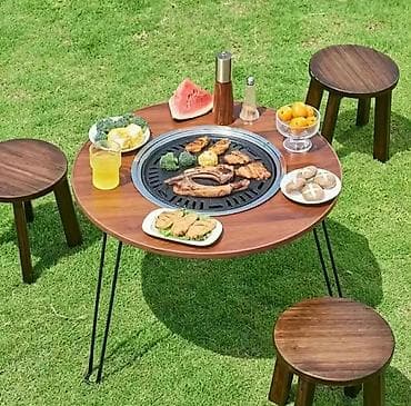 Okrugli baštenski sto sa integrisanim roštiljem/ognjištem u centru