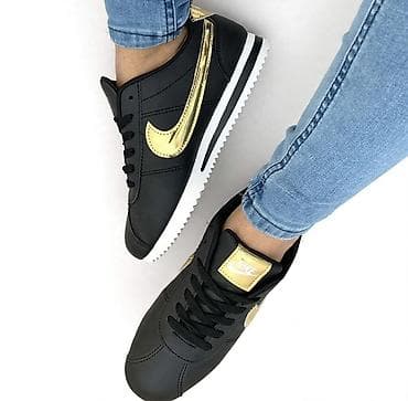 alter obuca: Ženske patike Nike Cortez u crno-zlatnoj kombinaciji. Karakteristike — 1