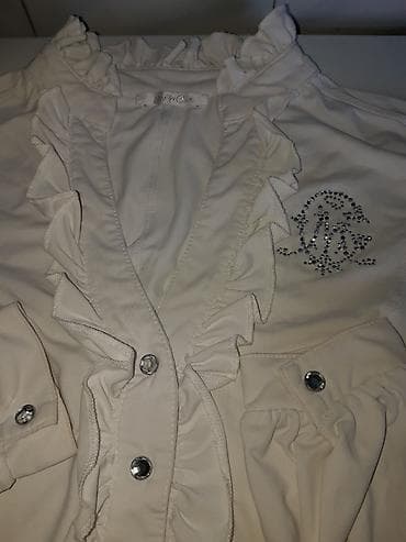 tigrovo oko: Mayo Chix beli bodi od likre, dugih rukava. Model sa volanima oko — 4