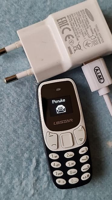 Car Electronics: L8STAR mini mobilni telefon + punjač Opis: - Ultra-kompaktan mobilni — 4