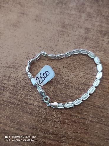 dkny jewellery: Srebrna narukvica sa finim segmentima u obliku zrna, svaka karika — 1