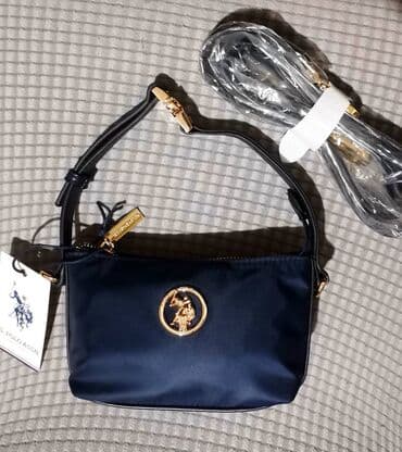 krzna za jakne: 50% NIZA CENA
NOVO SA ETIKETOM!
U. S. POLO TORBICA - DIMENZIJE 18X11CM — 1