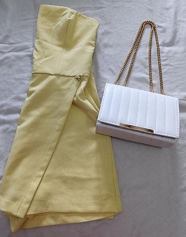 Žuti mini kombinezon bez bretela + bela torbica sa zlatnim lancem