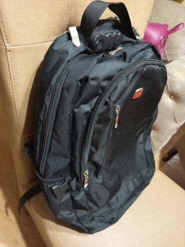 Trotineti, skejtbordovi i hoverbordovi: Crni ranac. Made in Swiss ojacan. Nеma ostecenja .Duzina 50cm,sirina — 7