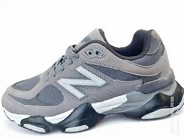 Sive patike za trčanje/šetnju sa istaknutim “N” logom sa strane