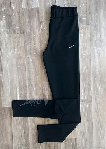 Crne Nike zenske helanke. - Uski kroj sa elastičnim pojasom,visok