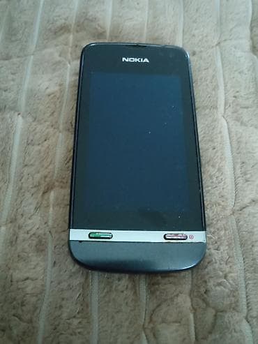 midnight boja: Nokia touchscreen telefon sa fizičkim tasterima za poziv i prekid — 1