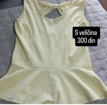 sportske zenske torbe preko ramena: Jednostavna ženska peplum bluza svetložute boje. Dizajn bez rukava sa — 1