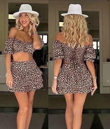 versace dylan blue zenski set: Dvodijelni ženski set – top i mini suknja s volanima
3300 din
S M L — 1