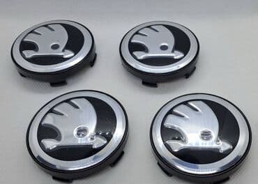 20555 r16 felni: Čepovi za felne ŠKODA - set 4 komada Čepovi za felne sa logom ŠKODA - — 1