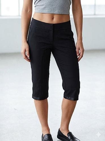 polu rolke: Crne ženske kapri pantalone, dužine do ispod kolena. Karakteriše ih — 1