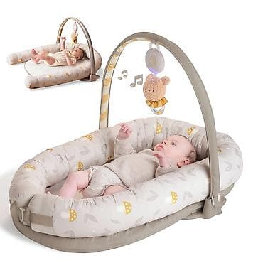Taf Toys bebi gnezdo – višenamensko muzičko gnezdo sa lukom za igračke