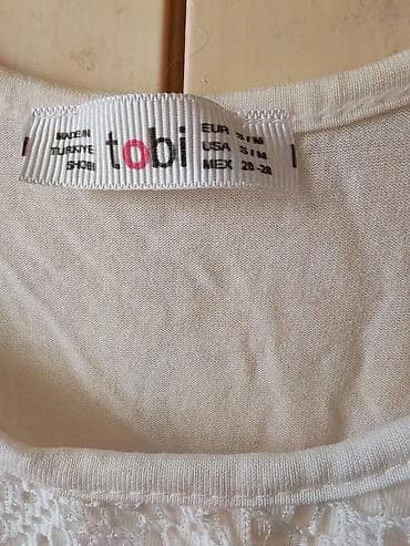 majice 8 razred: Beli ženski top bez rukava sa čipkom i resama – brend Tobi. - Kroj — 2