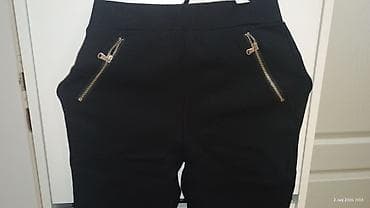 nike biciklisticke: Crne ženske pantalone sa elastičnim strukom i uskim nogavicama. Model — 5