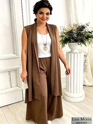 Elegantni ženski komplet za punine dame sastavljen od: - bezrukavog