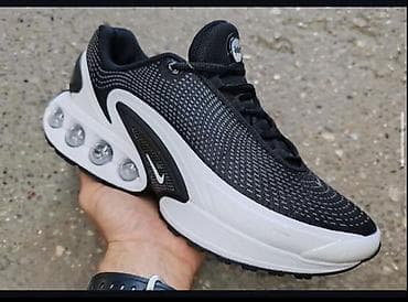 Patike za trčanje i svakodnevno nošenje, crno‑bele boje, sa naglašenim