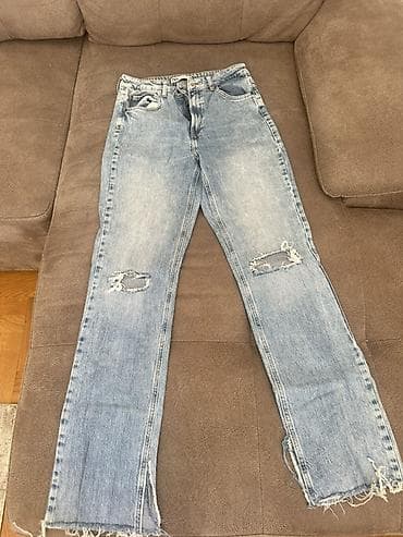 plitke farmerke: Blago zvonaste farmerke dubokog struka svetloplavog teksasa sa — 1