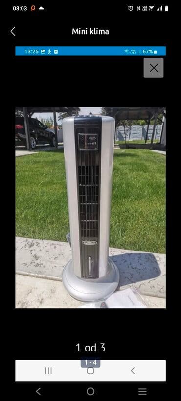 Stubni ventilatori: Vertikalni rashlađivač vazduha u srebrnoj boji sa crnim detaljima na