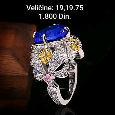 Elegantni posrebreni prsten sa velikim plavim ovalnim kamenom i