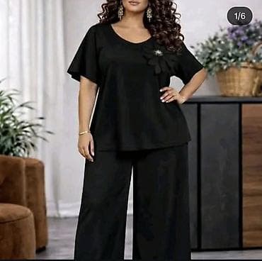 Komplet za punije dame u elegantnoj crnoj boji. - Bluza sa V-izrezom