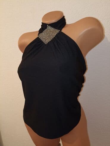 triple s: Kao nova majica, ima elastina.Velicina M — 3