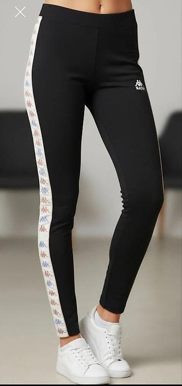 Kappa ženske trenerka-helanke, crne boje. Uski kroj sa elastičnim