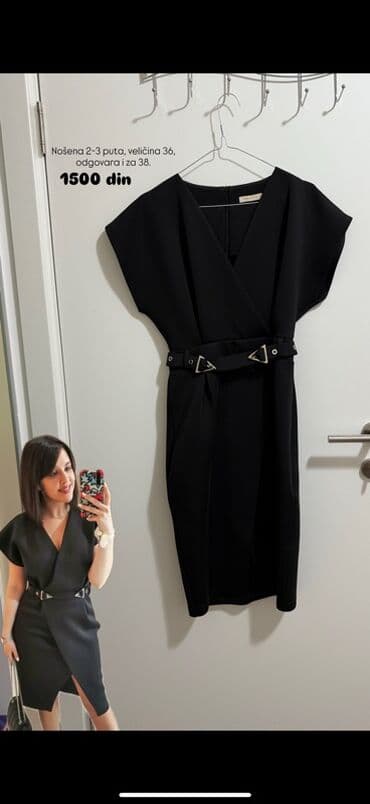 starke 36: Elegantna crna haljina sa pojasom i metalnim detaljima. - Kroj: midi — 1