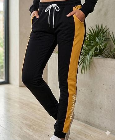 Ženske trenerke pantalone sa bočnim kontrastnim panelima. - Boja na lalafo.rs Ženske trenerke pantalone sa bočnim kontrastnim panelima. - Boja