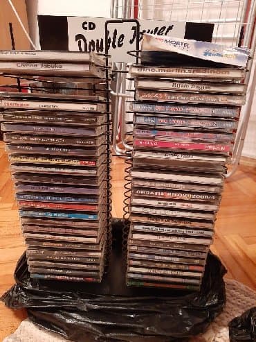 Dva stalka za cd sa preko 50 hitova colica bjelog dugmeta cece baje