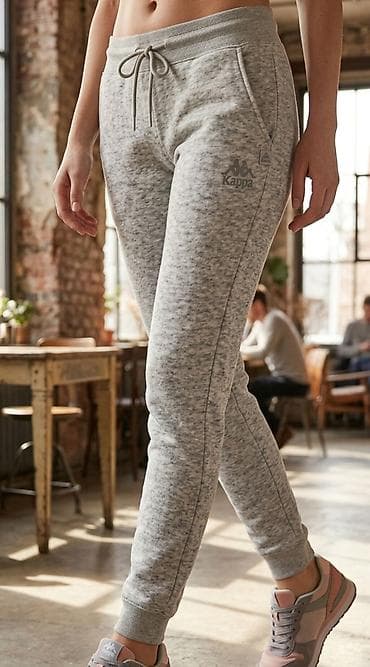 Ženske Kappa trenerke – sivo melanž - Kroj: slim/jogger silueta sa na lalafo.rs Ženske Kappa trenerke – sivo melanž - Kroj: slim/jogger silueta sa