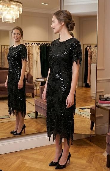 Elegantna crna večernja haljina sa šljokicama - Kroj: midi dužina na lalafo.rs Elegantna crna večernja haljina sa šljokicama - Kroj: midi dužina