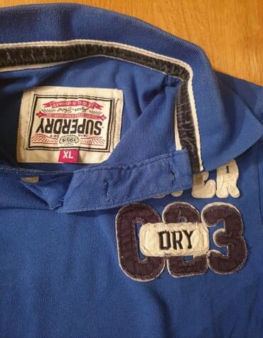 zimske jakne c a: SuperDry, super dry plava polo majica sa kragnicom. Piše XL velicina — 2