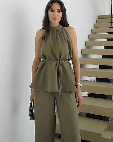 Damski komplet – bezrukavna bluza sa peplum krojem i široke pantalone