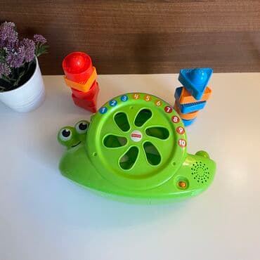 volan igracka za decu: Fisher Price muzicki interaktivni puz sa kockama razlicitog oblika — 2