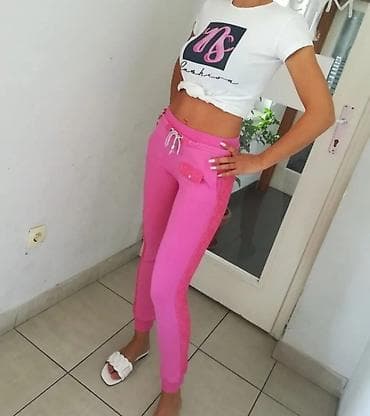 prljavo roza boja: Ženske trenerke – roze - Model: uski kroj sa elasticiranim manžetnama — 6