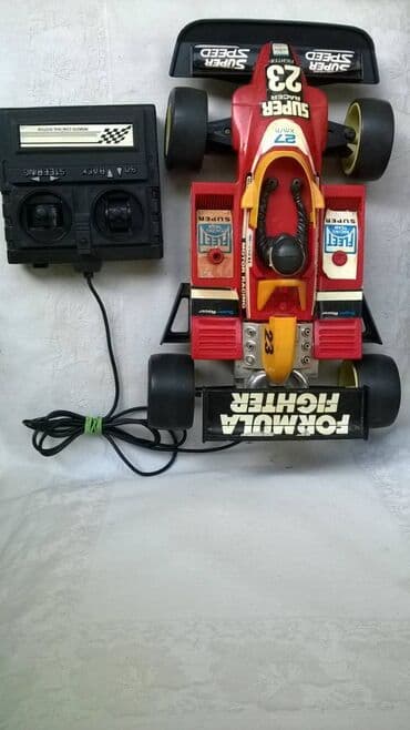 svrca auto na akumulator: Na daljinski auto Formula 1:18 (33 cm.) na kabl, ispravan, levo/desno — 2