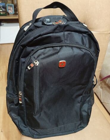 Trotineti, skejtbordovi i hoverbordovi: Crni ranac. Made in Swiss ojacan. Nеma ostecenja .Duzina 50cm,sirina — 5