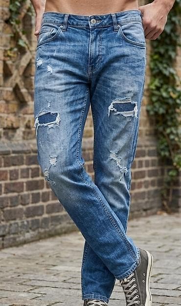 Muške farmerke sa poderotinama – svetlo do srednje plavi denim -